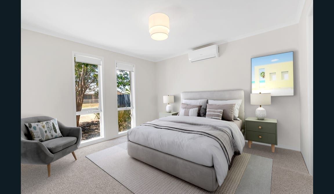 A bedroom at Peerless Road, with a built-in robe and a window to the garden