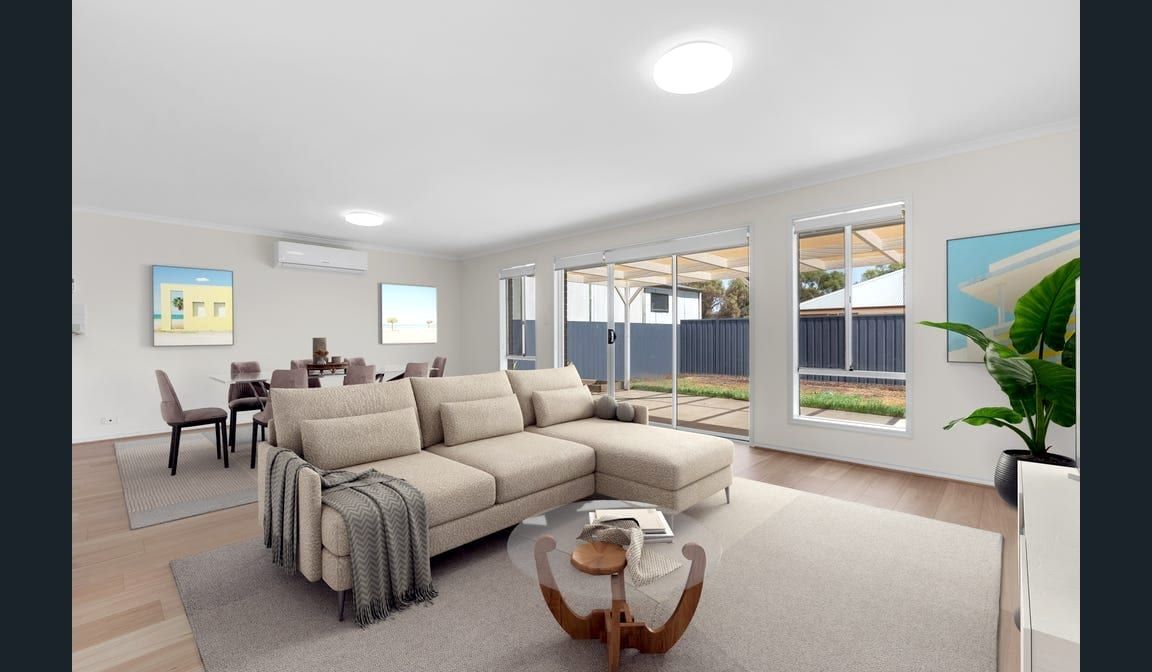 The open living area at Peerless Road, with large windows to the rear yard